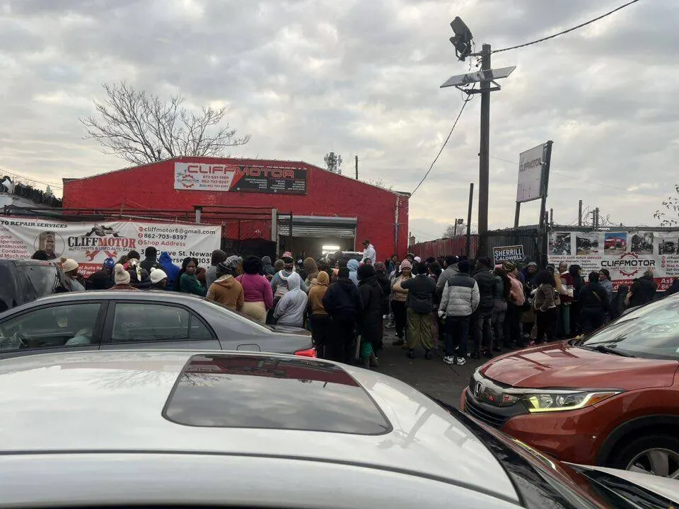 Community lined up outside the foundation warehouse